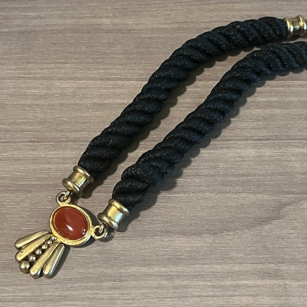Black Twisted Cord Choker With Gold Accents And Rust Stone